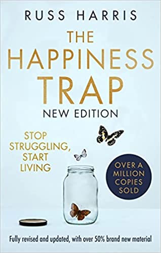 The front cover of a self help book called the Happiness Trap